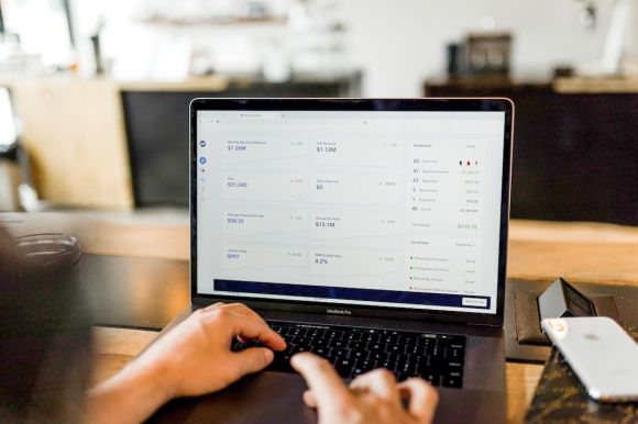 Product Return - person using MacBook pro