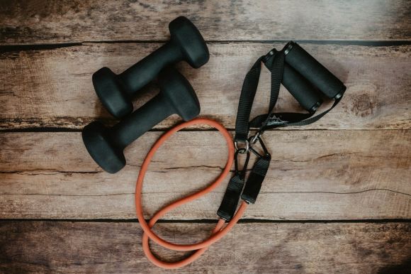 Sports Equipment - orange and black usb cable on brown wooden surface