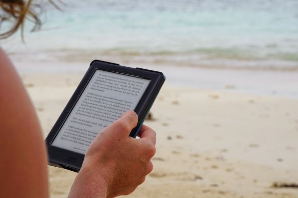 E-readers - person holding black tablet computer during daytime