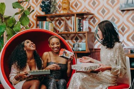 Group Gifting - Photo of a Group of Friends Giving Gifts