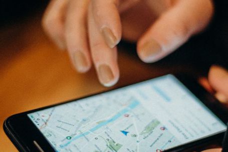 GPS Devices - Person Holding Black Android Smartphone