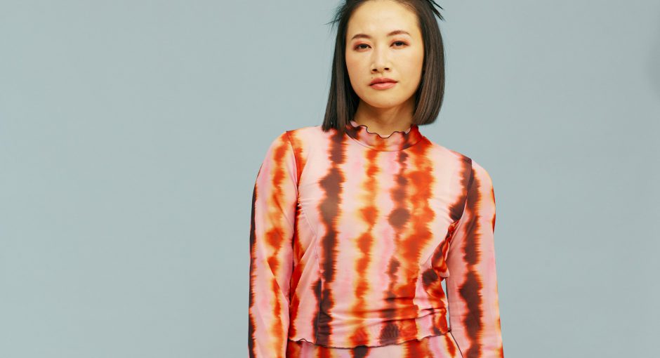 person in modern orange clothing